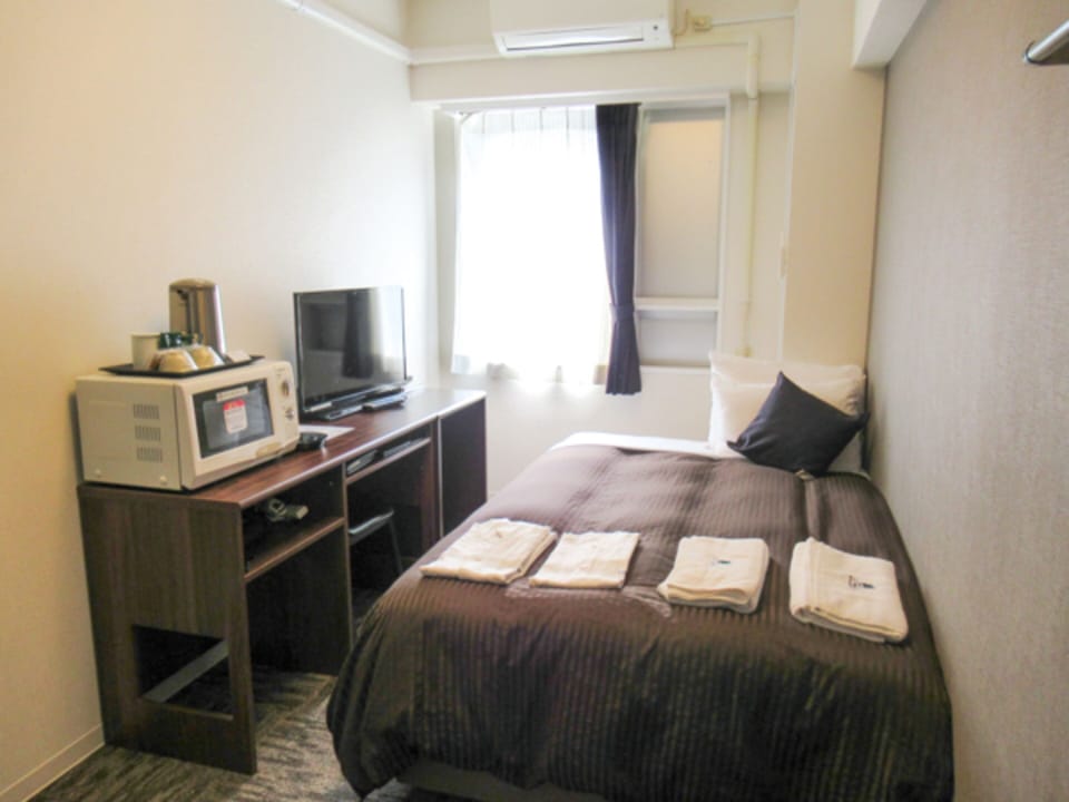 Desk, laptop workspace, free WiFi, bed sheets