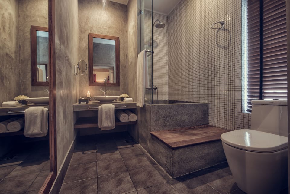 Executive Suite | Bathroom | Combined shower/tub, deep soaking tub, free toiletries, bathrobes