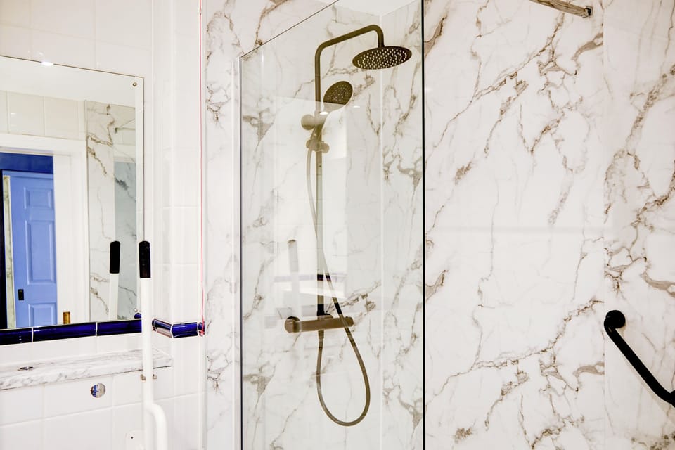 Triple Room, Multiple Beds (UA, Wet) | Bathroom | Shower, hair dryer, towels