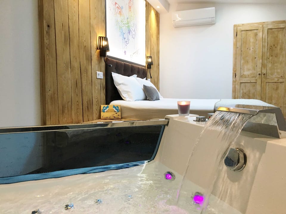 Luxury Double Room, Terrace, Garden View | Minibar, in-room safe, individually decorated, desk