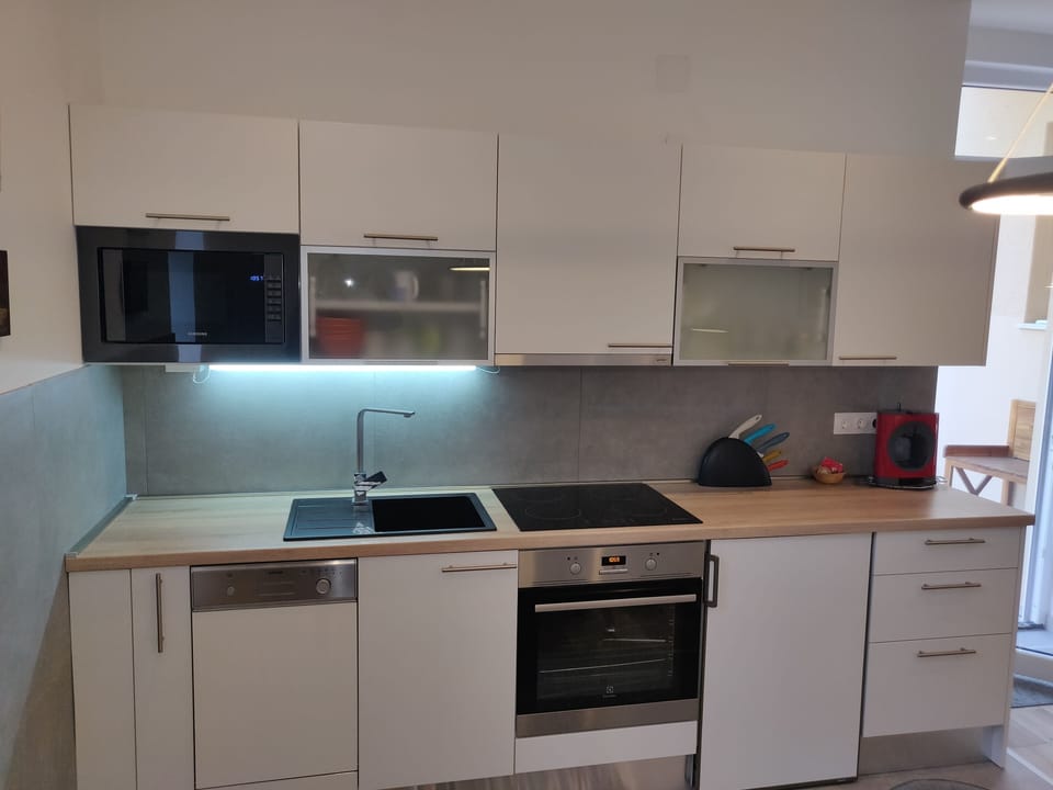 Apartment, 2 Bedrooms | Private kitchen | Coffee/tea maker, full-size fridge, microwave, oven