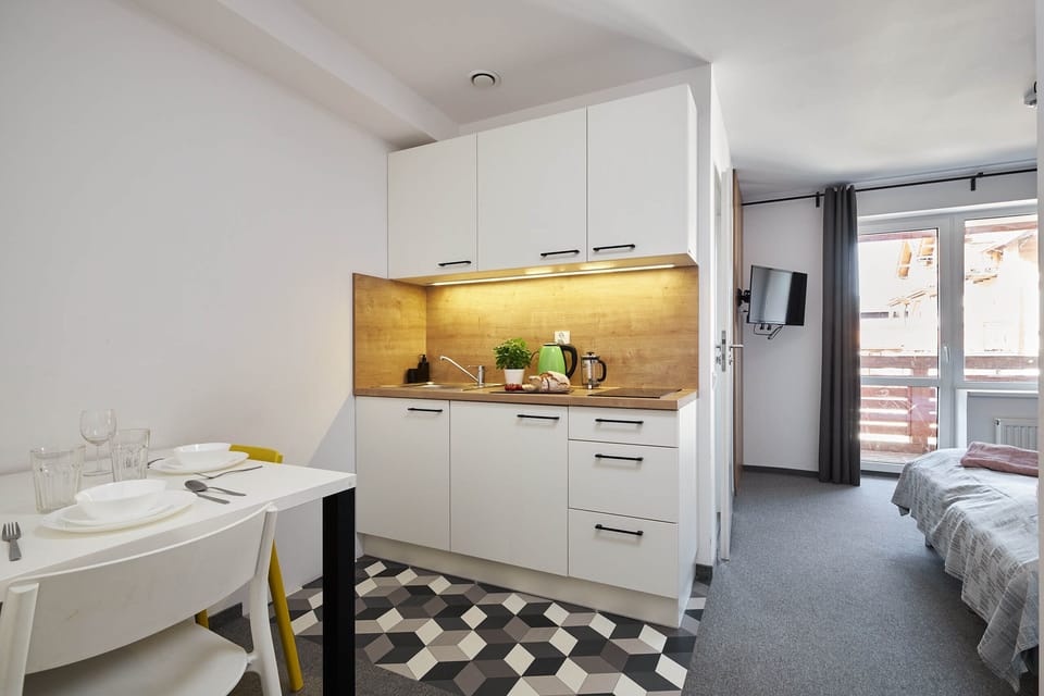 Mini-fridge, stovetop, electric kettle, highchair