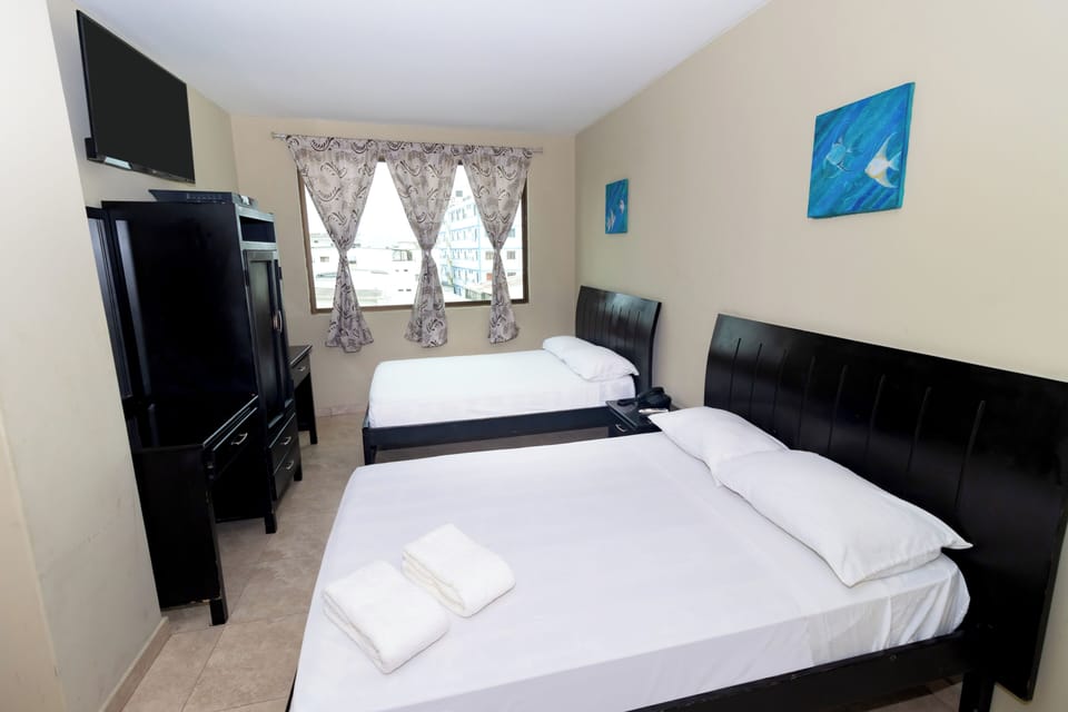 Double Room | Blackout drapes, iron/ironing board (on request), bed sheets