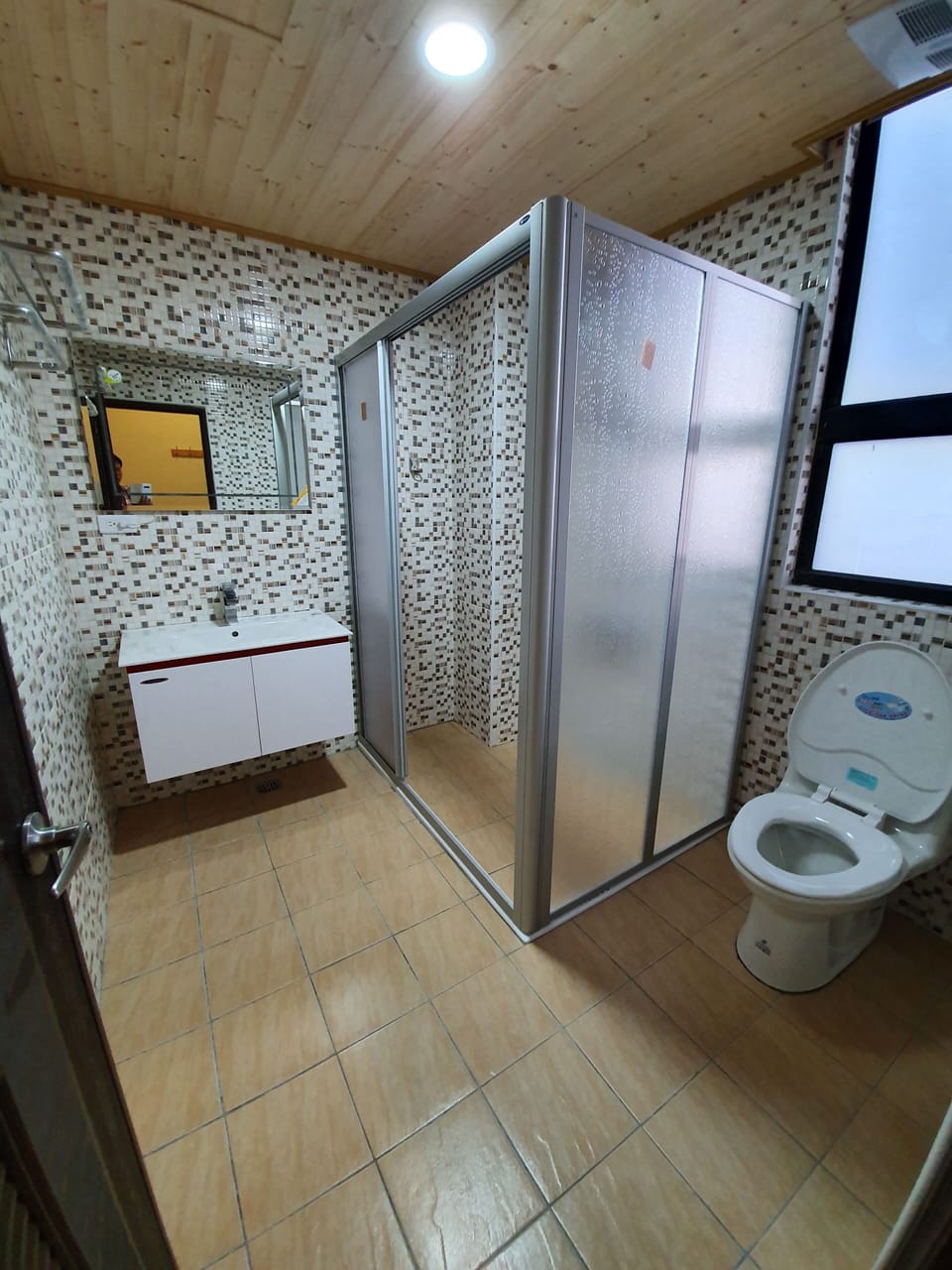 Shower, free toiletries, hair dryer, slippers
