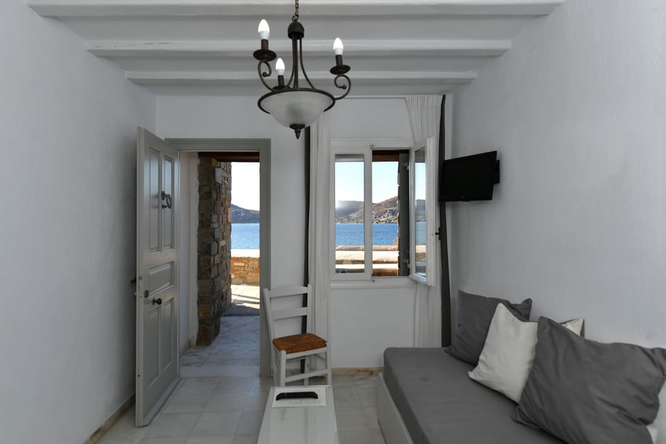 Standard Suite, Sea View | Living area | Flat-screen TV