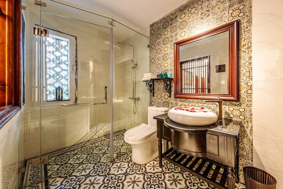 Deluxe Double Room, Courtyard Area | Bathroom | Shower, hair dryer, slippers, towels