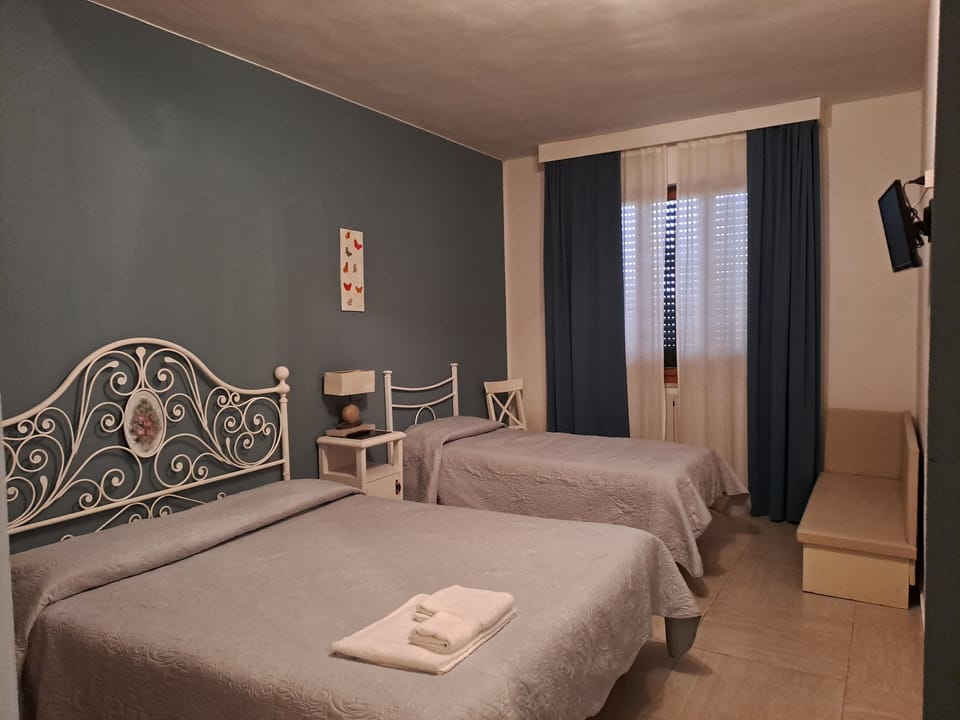 Quadruple Room, Private Bathroom | Hypo-allergenic bedding, down comforters, free minibar items