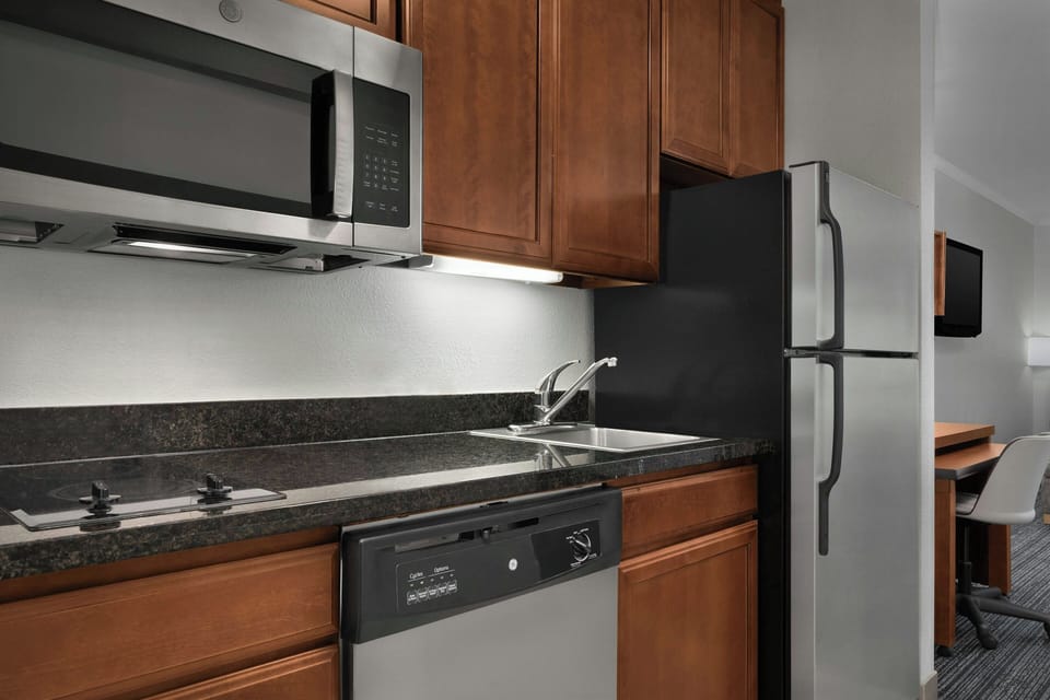 Suite, 1 King Bed with Sofa bed | Private kitchen | Coffee/tea maker, fridge, microwave, stovetop
