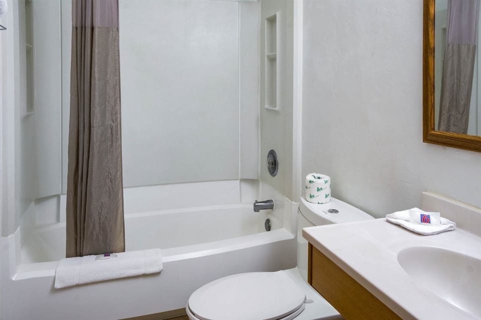 Desk, laptop workspace, bed sheets