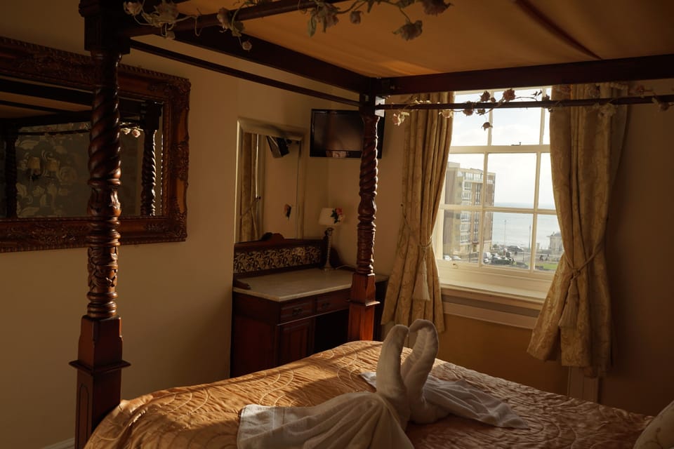 Four Poster Double Room with Seaview | 1 bedroom, individually decorated, individually furnished, desk