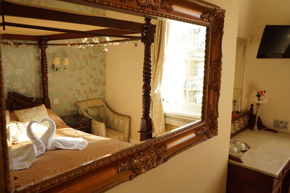 Four Poster Double Room with Seaview | 1 bedroom, individually decorated, individually furnished, desk