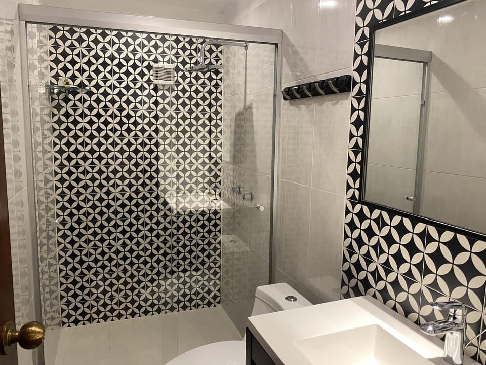 Deluxe Room, 1 Queen Bed | Bathroom | Shower, towels, soap, shampoo