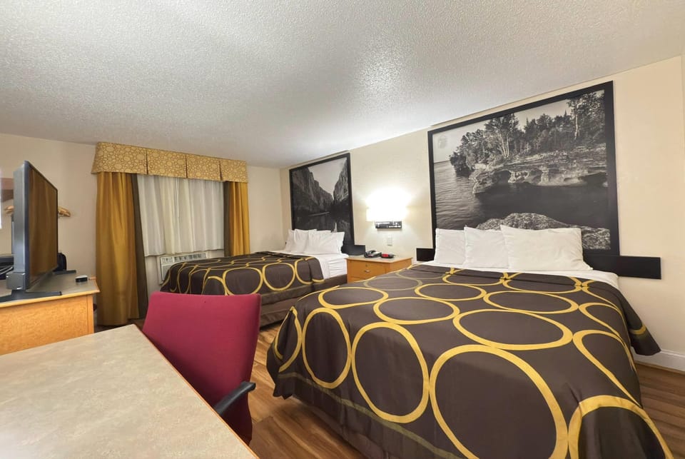 Desk, blackout drapes, iron/ironing board, rollaway beds