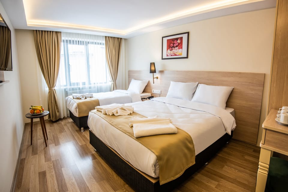 Standard Triple Room | Minibar, in-room safe, soundproofing, WiFi (free)