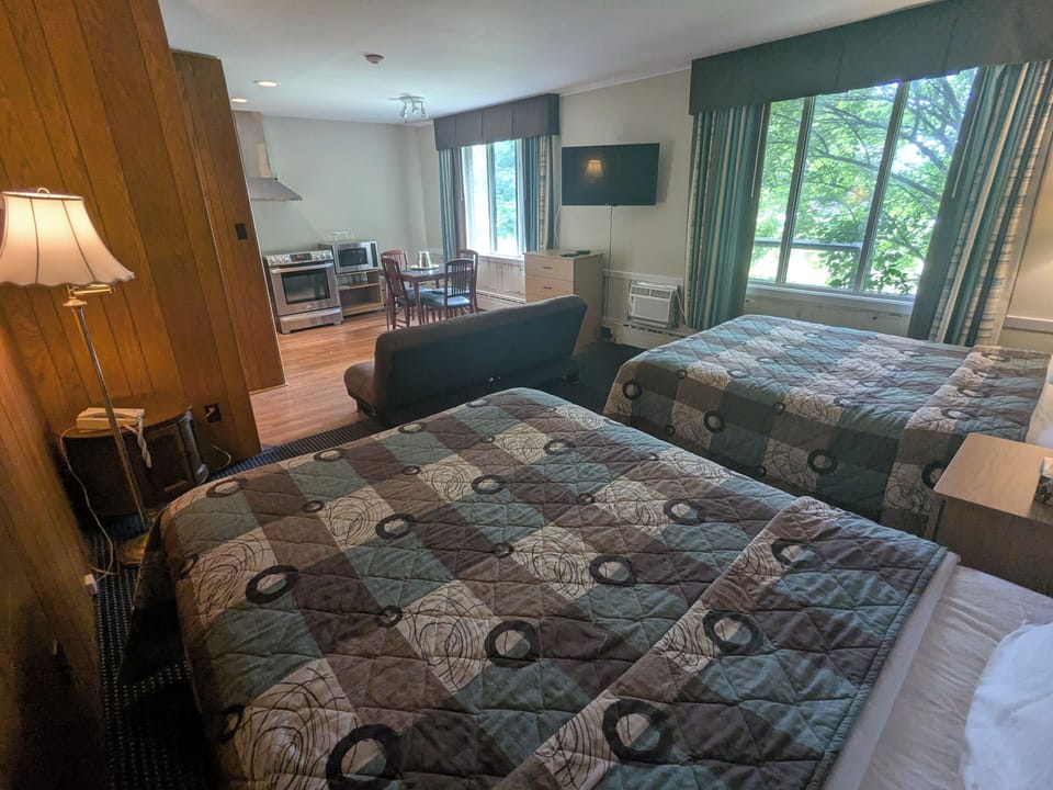 Premium Studio Suite, Multiple Beds, Kitchenette, Garden View | Desk, laptop workspace, blackout drapes, iron/ironing board (on request)