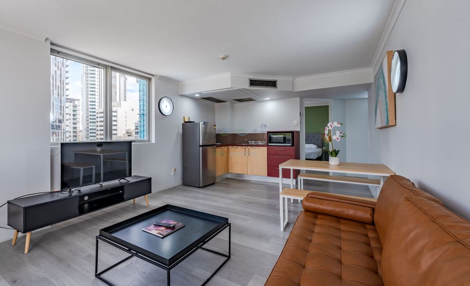 Deluxe Apartment | Living area | TV