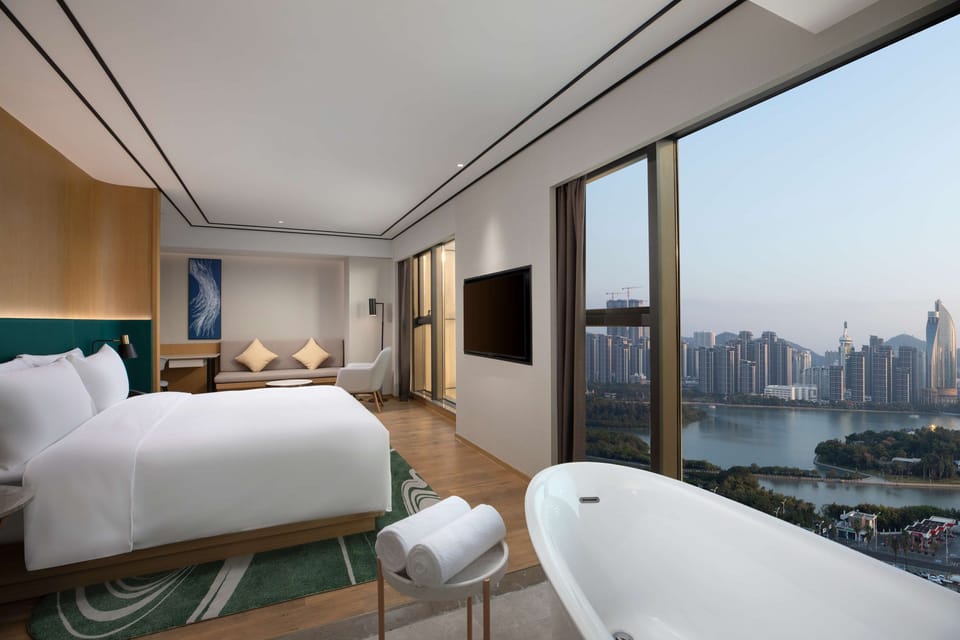 Deluxe Room, 1 King Bed, Lake View | In-room safe, desk, blackout drapes, bed sheets