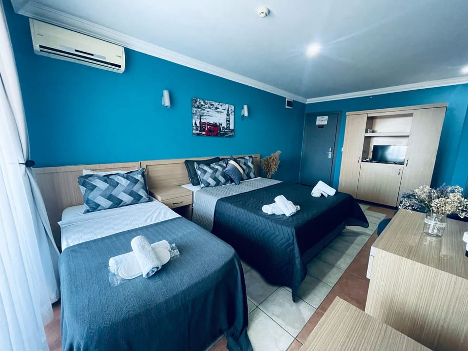 Standard Twin Room | Minibar, desk, bed sheets, wheelchair access