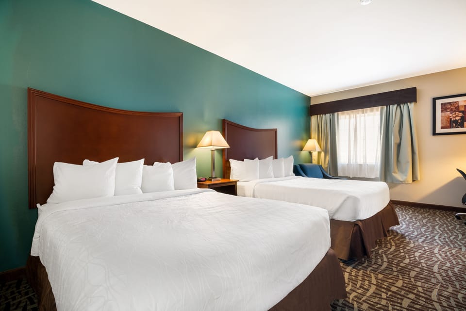 Standard Room, 2 Queen Beds, Non Smoking, Refrigerator & Microwave (Larger Room) | Desk, laptop workspace, soundproofing, iron/ironing board
