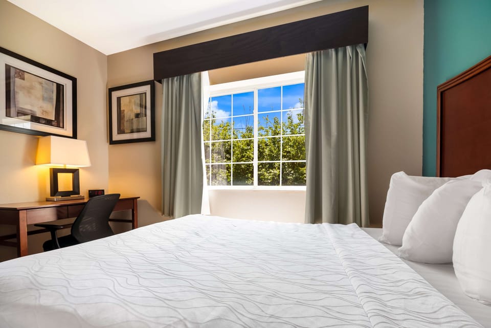 Suite, 2 Queen Beds, Non Smoking, Refrigerator & Microwave (Living Room;with Sofabed) | Desk, laptop workspace, soundproofing, iron/ironing board