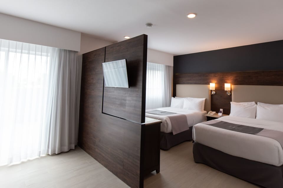 Premium bedding, down comforters, in-room safe, desk