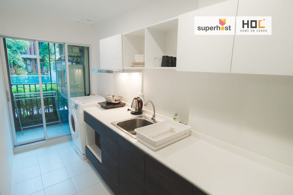Luxury Condo, Garden View | Private kitchen | Full-size fridge, microwave, stovetop, electric kettle