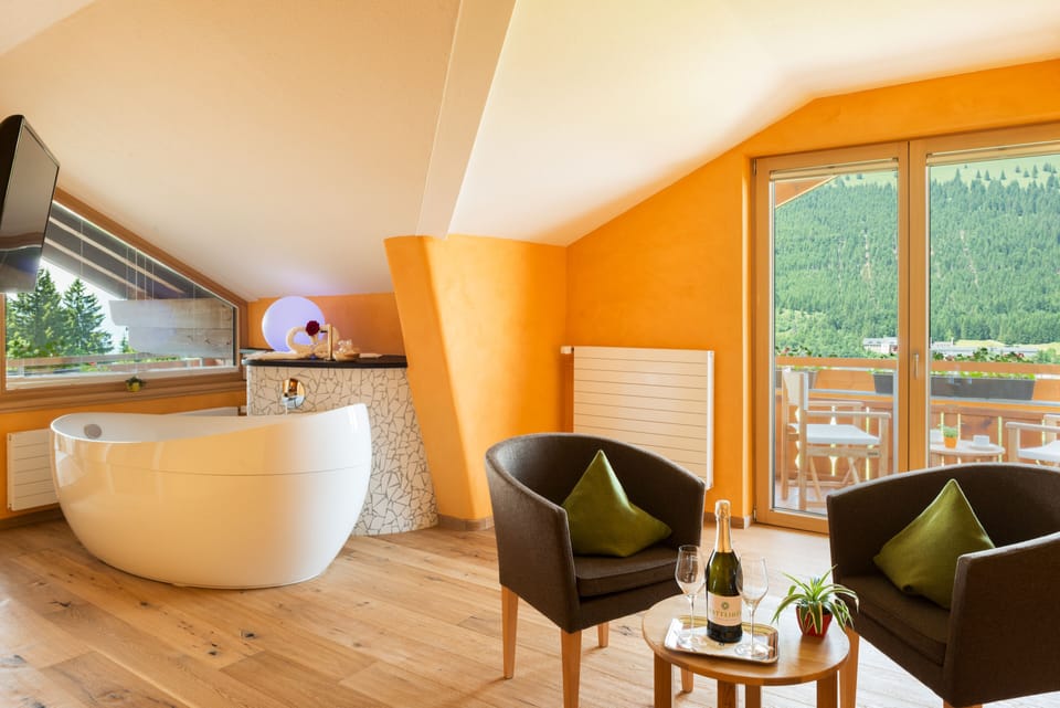 Junior Room, Bathtub, Mountain View | Living area | 30-inch LED TV with satellite channels, TV, heated floors
