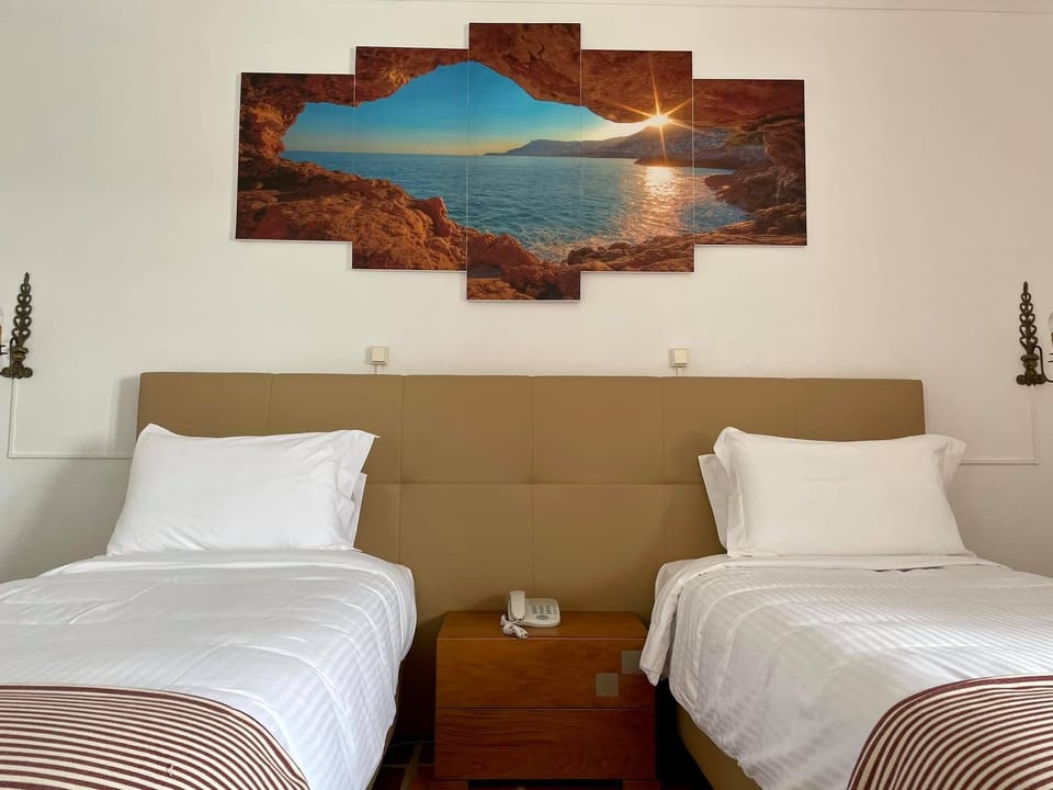 Standard Twin Room, Garden View | Pillowtop beds, in-room safe, individually decorated
