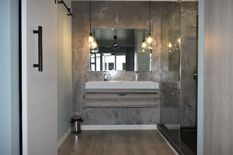 Shower, rainfall showerhead, designer toiletries, hair dryer