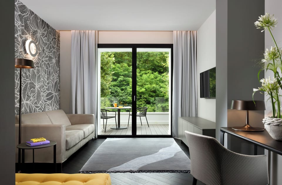 Suite, Garden View | Living area | 42-inch Smart TV with digital channels, TV, tablet