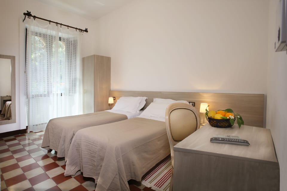 Economy Double or Twin Room | Minibar, in-room safe, desk, soundproofing