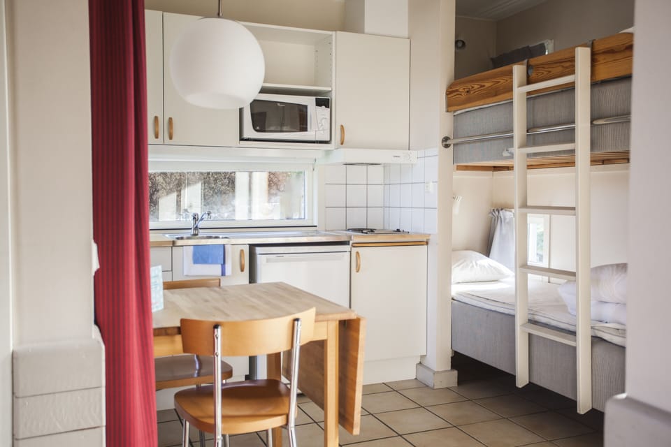 Cabin (Karusellbyn) | Private kitchenette | Shared fridge, microwave, paper towels, dining tables