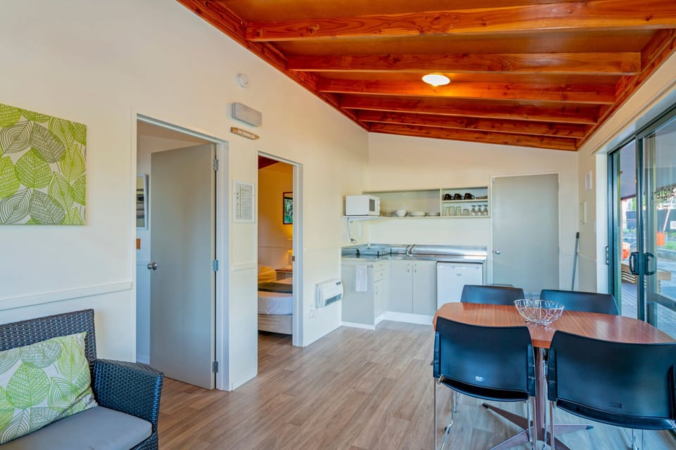 Two Bedroom Cabin | Private kitchenette | Microwave, highchair, cleaning supplies
