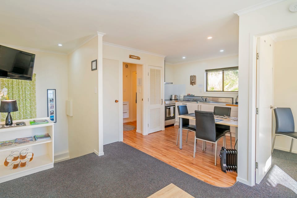 One Bedroom Penthouse | Living area | 32-inch flat-screen TV with satellite channels