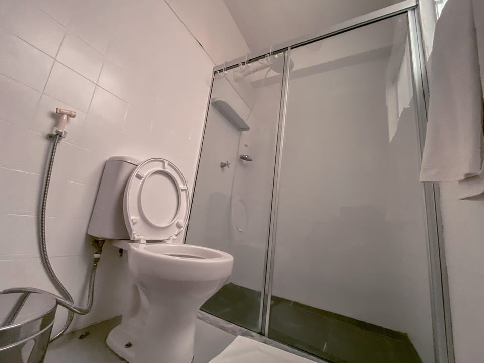 Shower, rainfall showerhead, hair dryer, towels