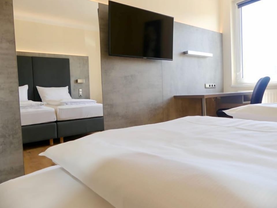 Superior Double Room | Living area | 40-cm flat-screen TV with satellite channels, TV