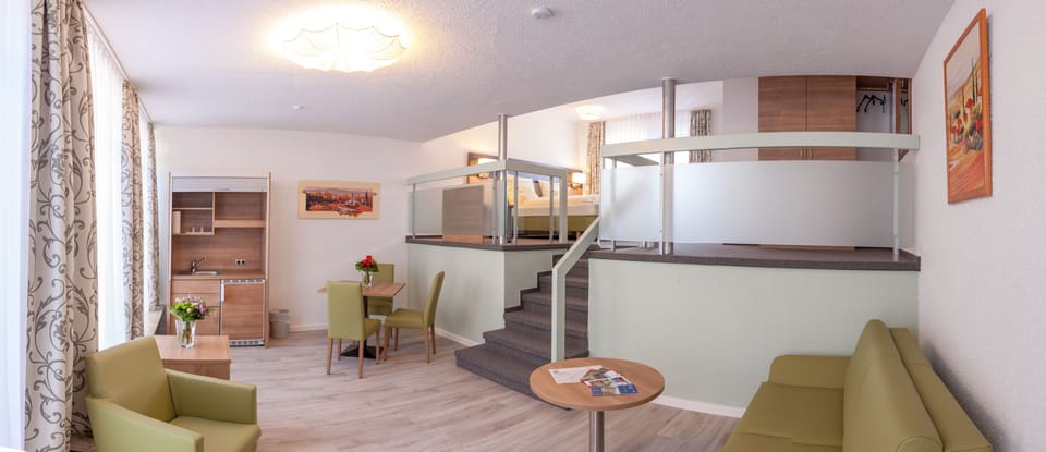 Superior Double Room | Living area | Flat-screen TV