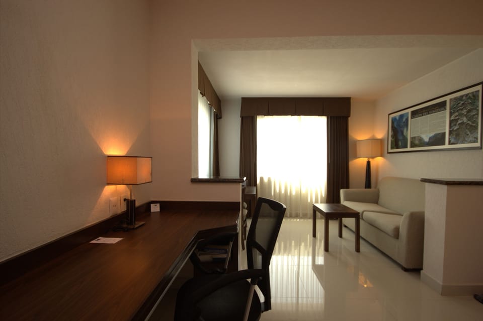 Suite, 1 King Bed | Down comforters, in-room safe, desk, blackout drapes