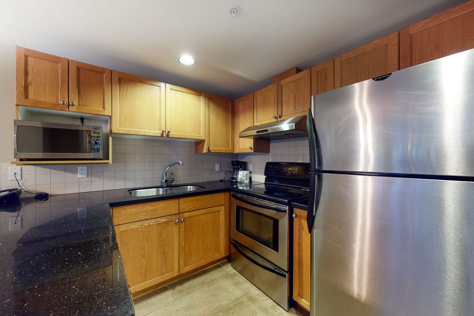 Condo | Private kitchen | Full-size fridge, microwave, oven, stovetop