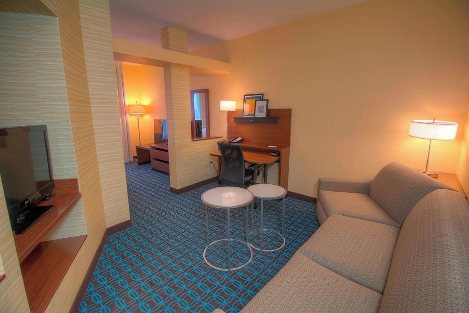 Suite, 1 King Bed with Sofa bed | Living area | 32-inch flat-screen TV with cable channels, TV