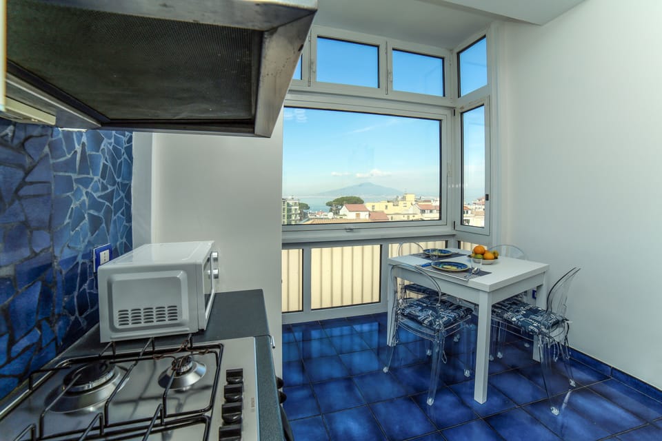 Family Apartment, 2 Bedrooms, Sea View | Private kitchen | Full-size fridge, microwave, oven, stovetop