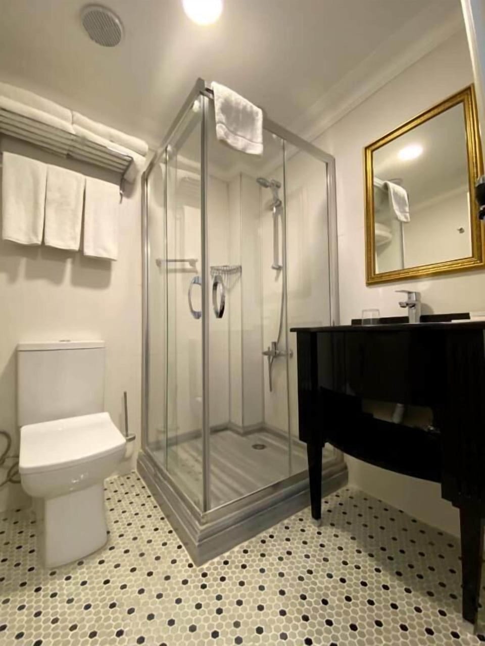 Shower, eco-friendly toiletries, hair dryer, slippers