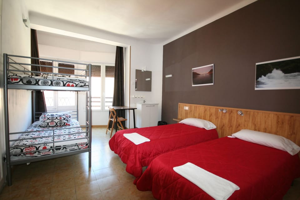Family Room, Shared Bathroom | Desk, blackout drapes, free cribs/infant beds, free WiFi
