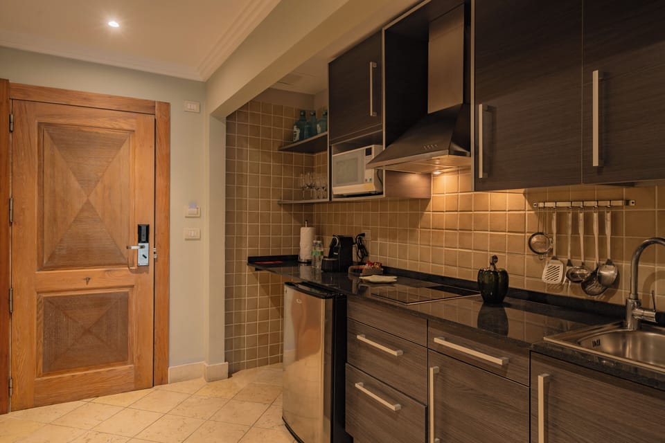 The Junior Suite, All-Inclusive | Private kitchen | Mini-fridge, microwave, oven, stovetop