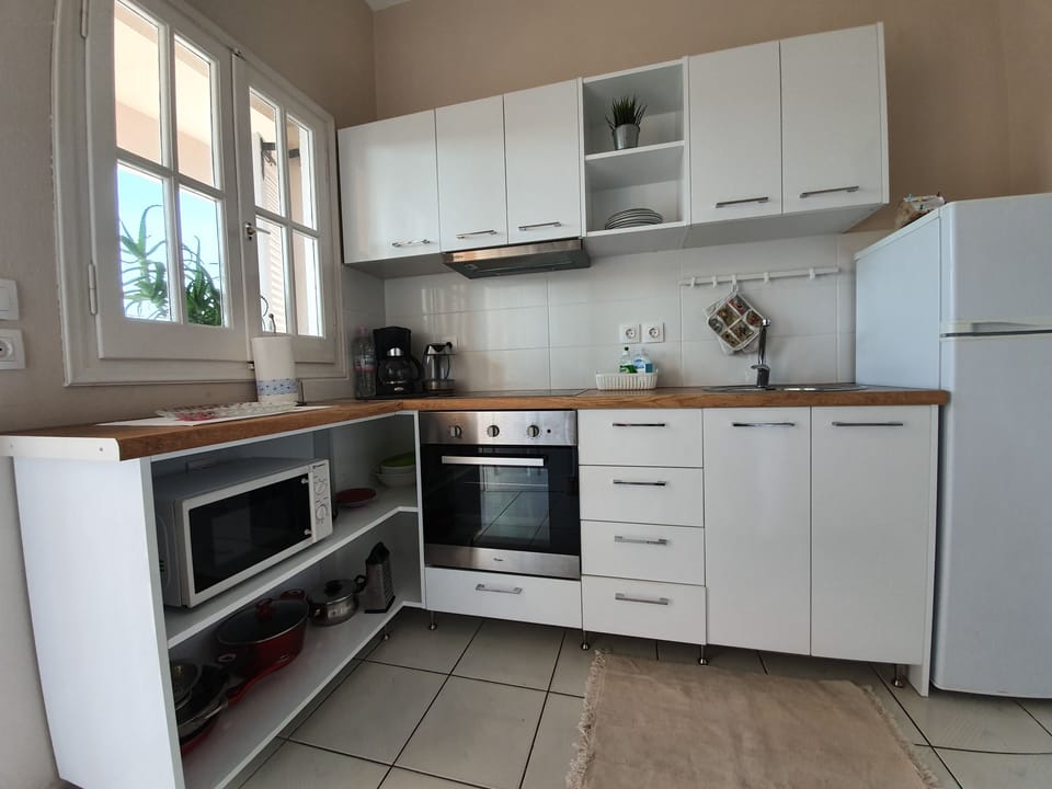 Family Apartment, 2 Bedrooms | Private kitchenette | Full-size fridge, electric kettle, cookware/dishes/utensils