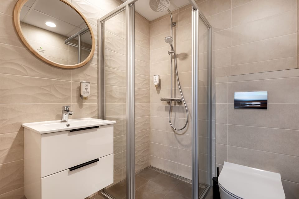 Shower, rainfall showerhead, hair dryer, heated floors