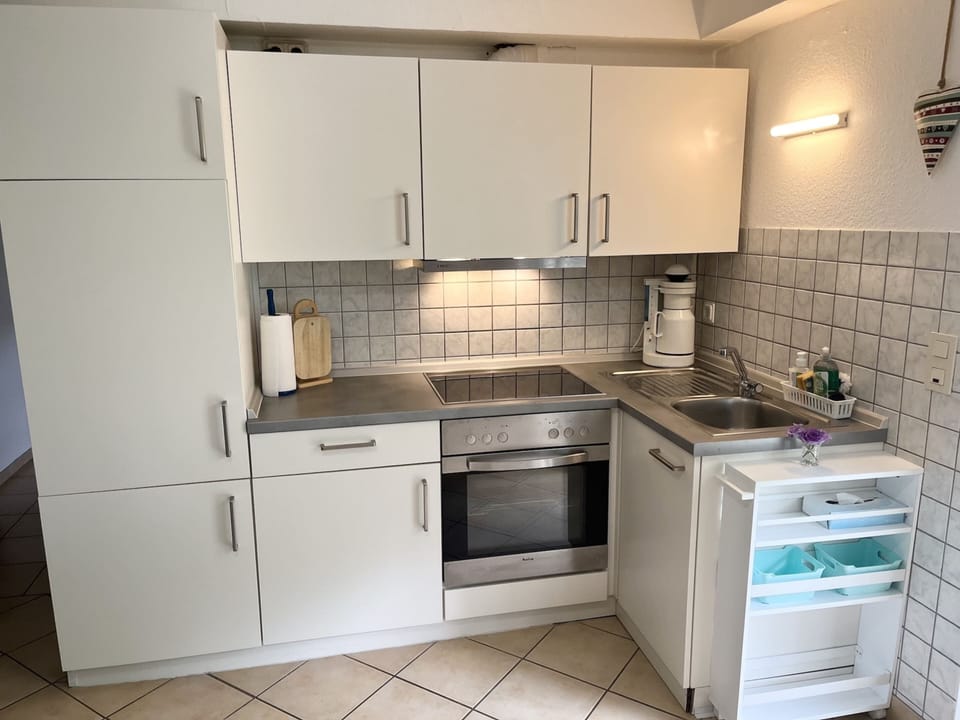 Apartment | Private kitchen | Stovetop, highchair