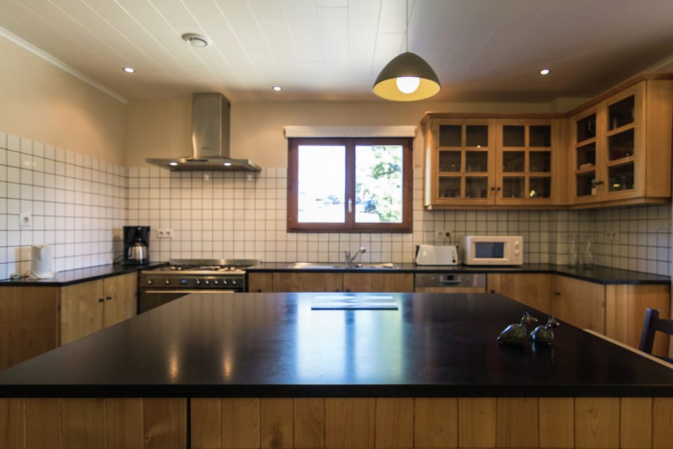 Villa | Private kitchen | Fridge, highchair