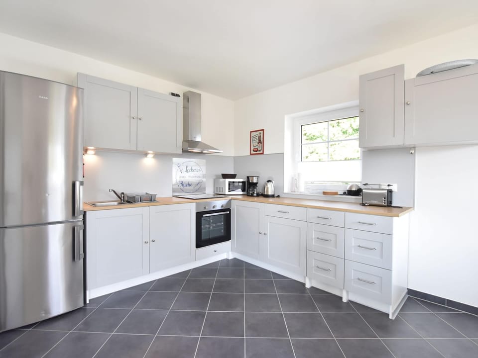 Apartment | Private kitchen | Stovetop, highchair