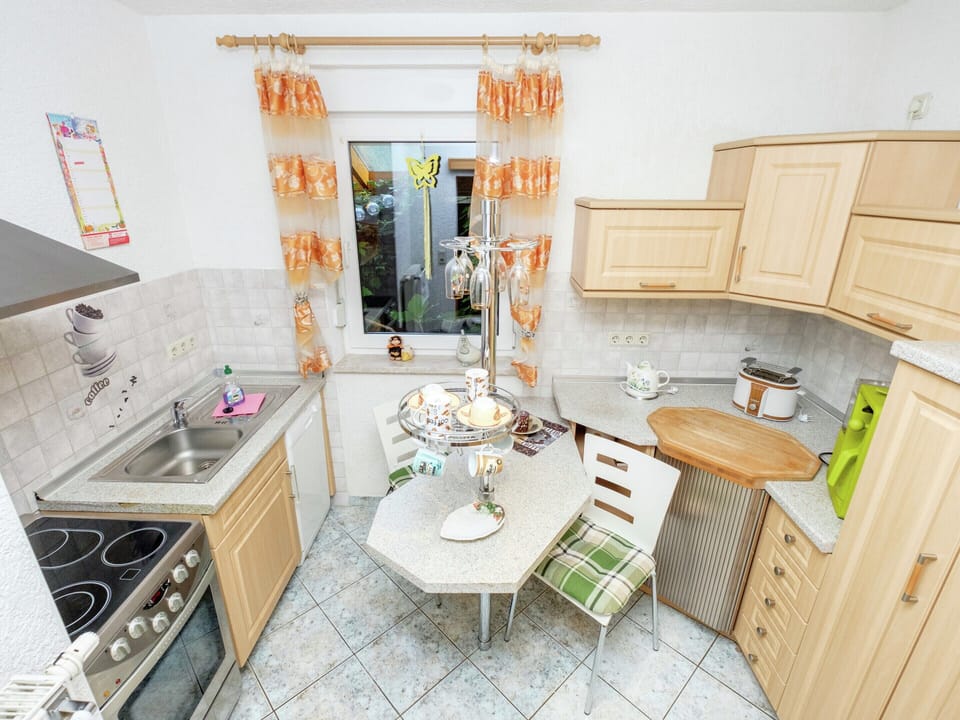 Apartment | Private kitchen | Stovetop, coffee/tea maker, highchair